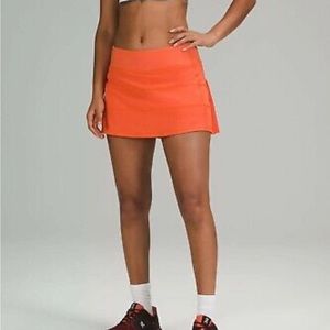 Lululemon pace rival skirt! Warm Coral color. Size 0.